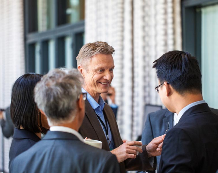 A group of business people engaged in a discussion.
