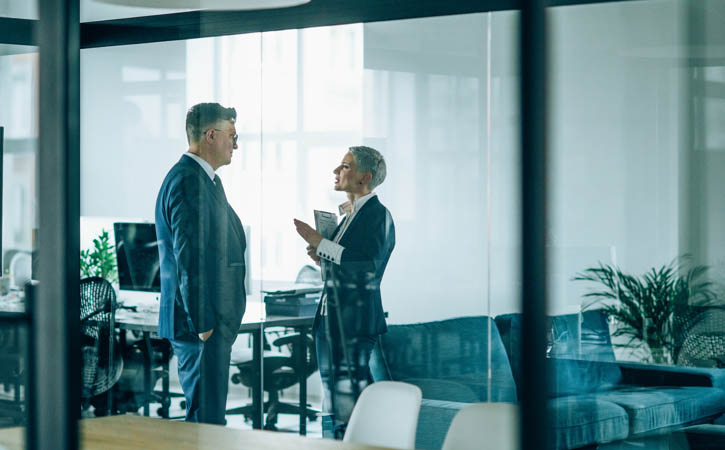 Business couple discussing important documentation