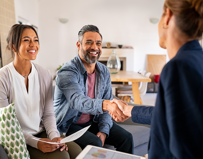 woman and clients shaking hands