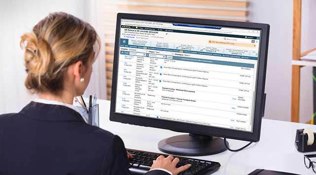 Business woman working at desktop compter