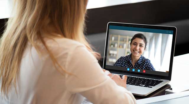 Business woman on zoom call with female client